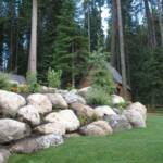 Beatifully landscaped boulder wall